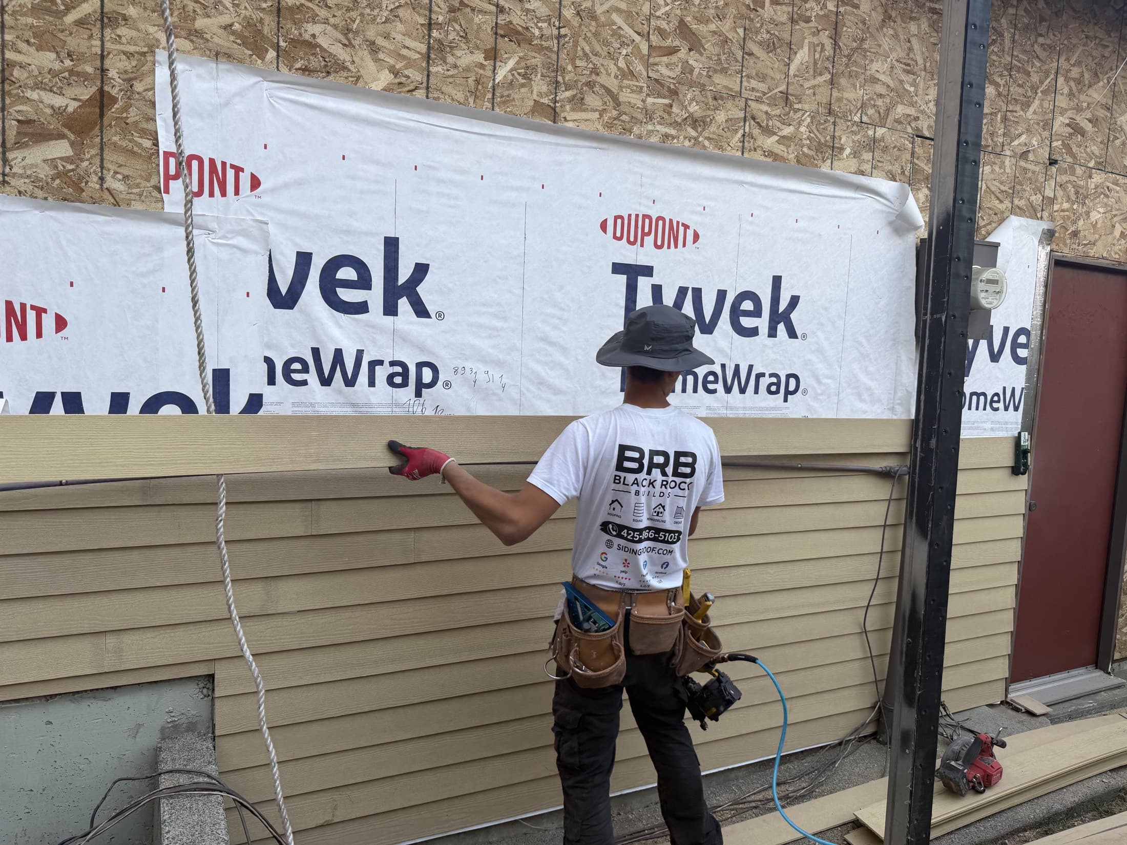 Black Rock Builds crew in front of a completed siding project